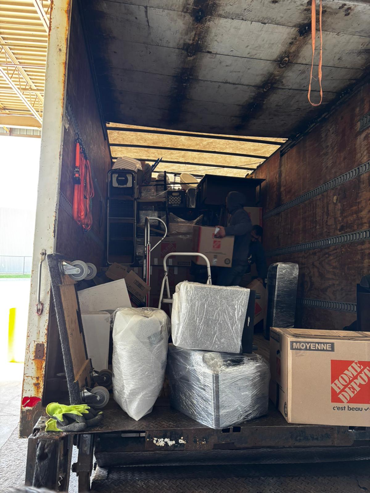 Ecoway Movers truck parked in a residential Oshawa neighborhood