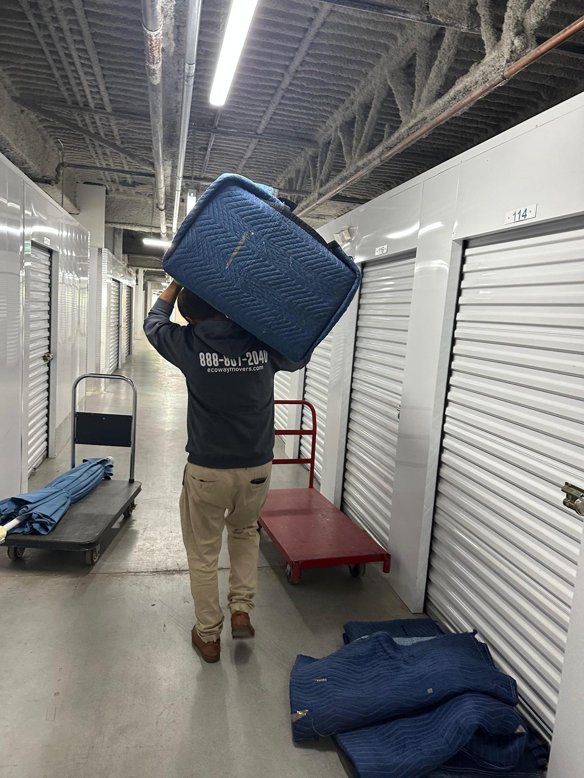 Movers loading boxes into the truck
