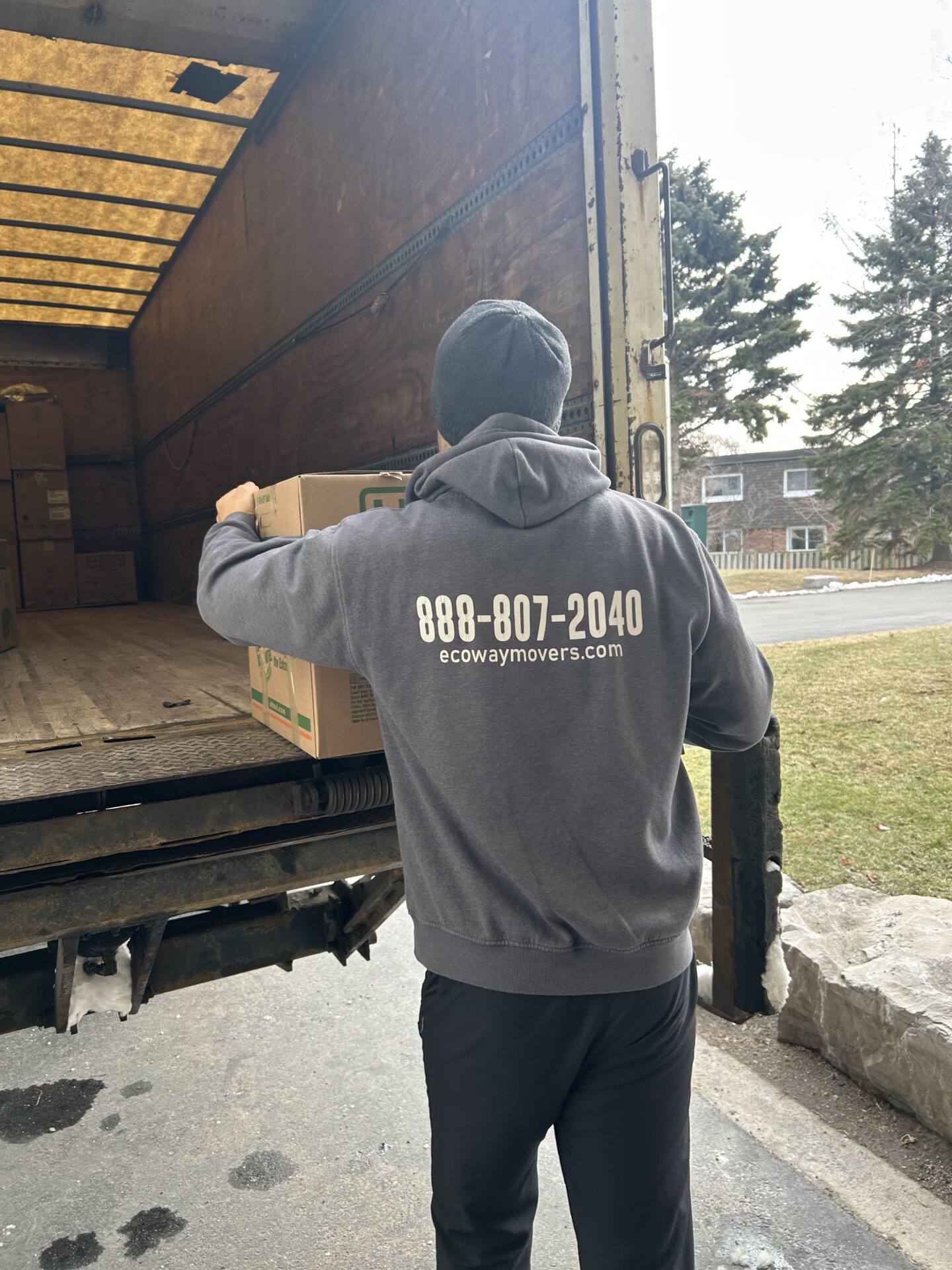Ecoway Movers Milton certified crew loading truck for residential move with professional packing equipment and floor protection protocol active