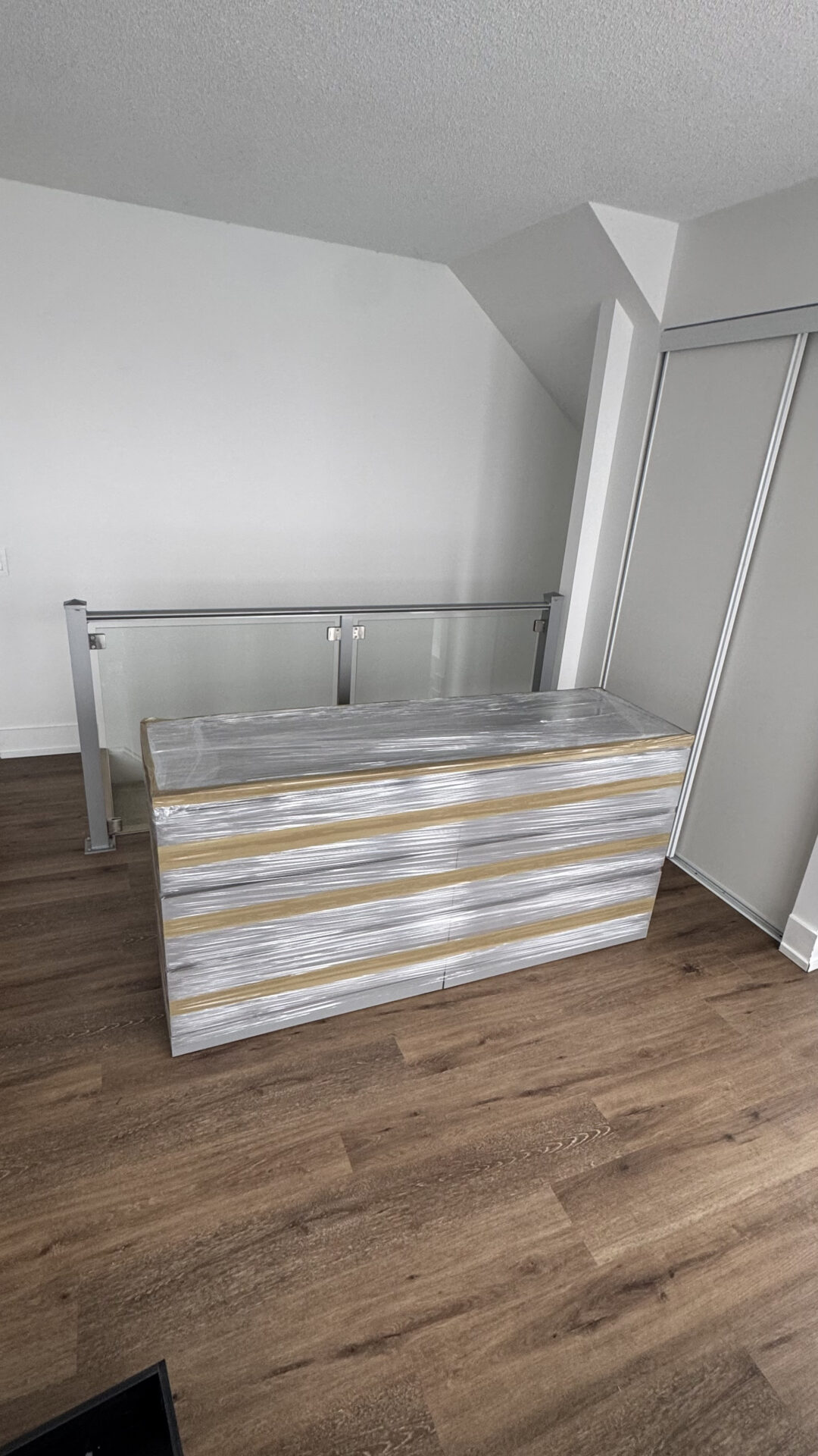 Ecoway Movers Victoria BC packing experts preparing a full home move with professional packing materials including bubble wrap and labelled boxes in a Fairfield residence