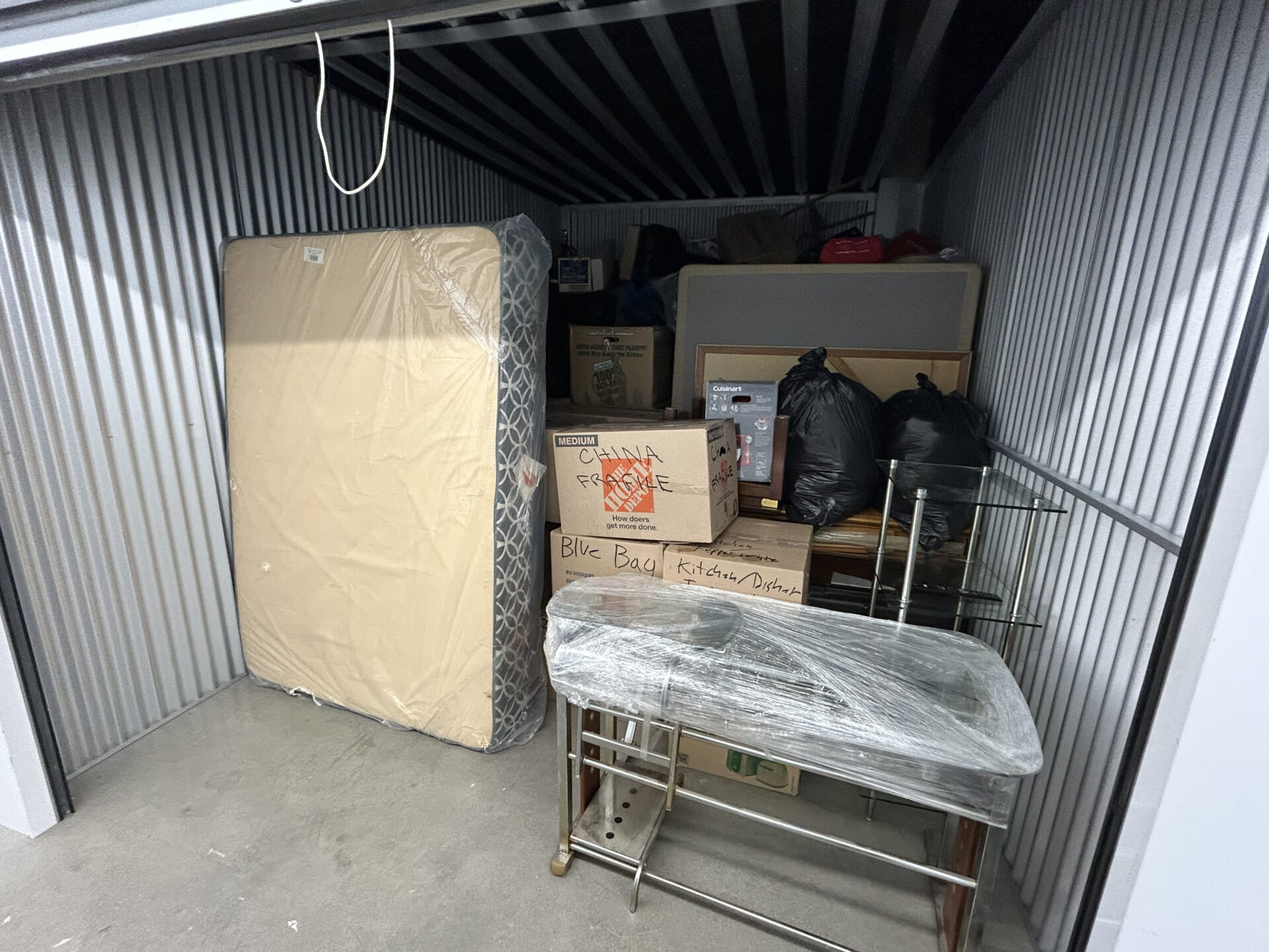 Ecoway Movers Innisfil crew loading household items onto truck during residential relocation in Alcona with furniture protection protocols in place