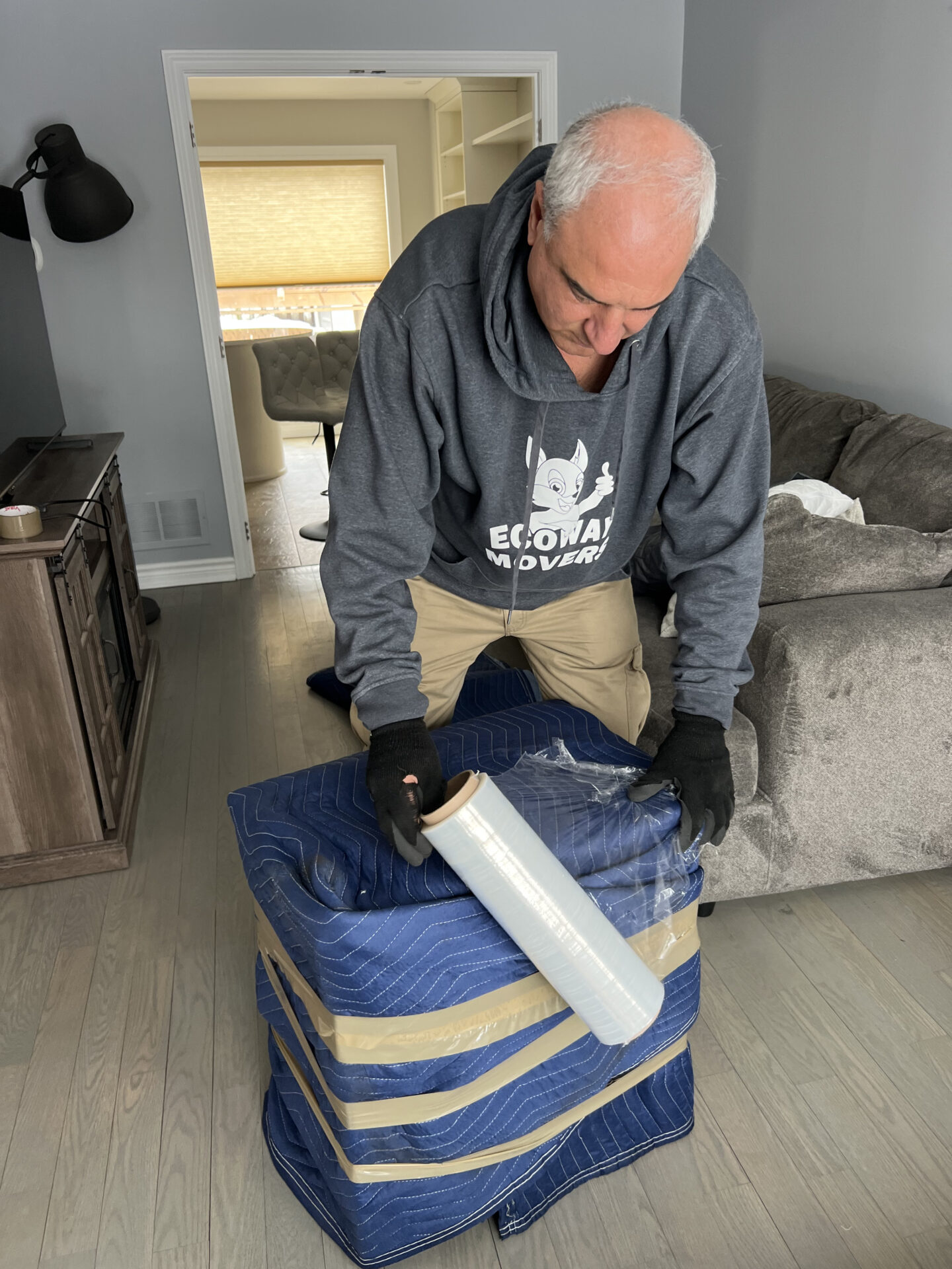 Ecoway Movers Kelowna team completing professional packing service using high-quality materials to protect household items before loading for local Kelowna move