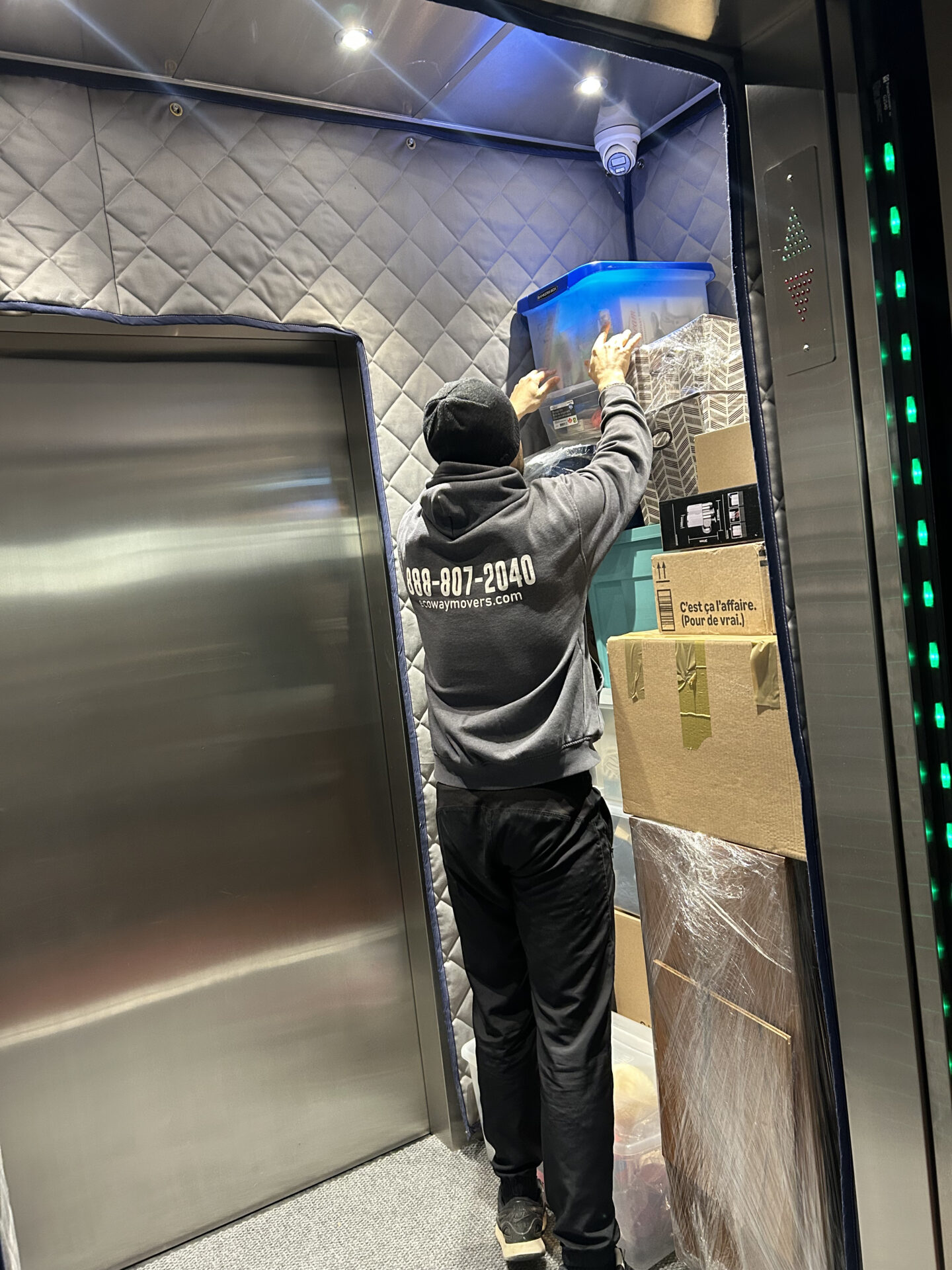 Ecoway Movers Waterloo professional crew loading labelled household boxes into moving truck during apartment relocation near University of Waterloo