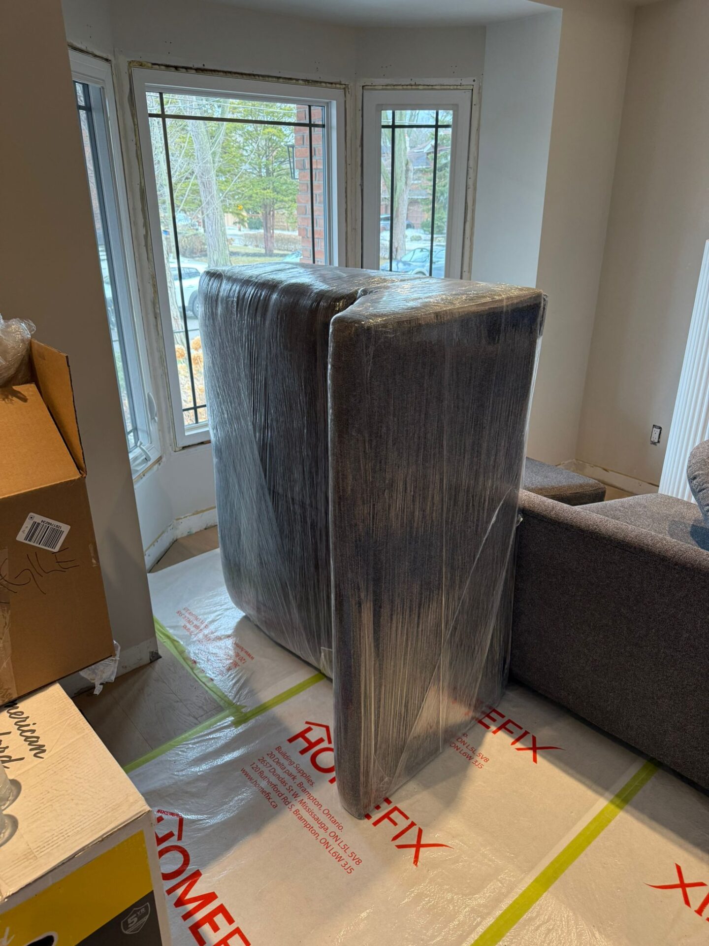 Ecoway Movers Waterloo trained packing crew carefully packing kitchen items and fragile belongings using professional packing materials during full-service packing job