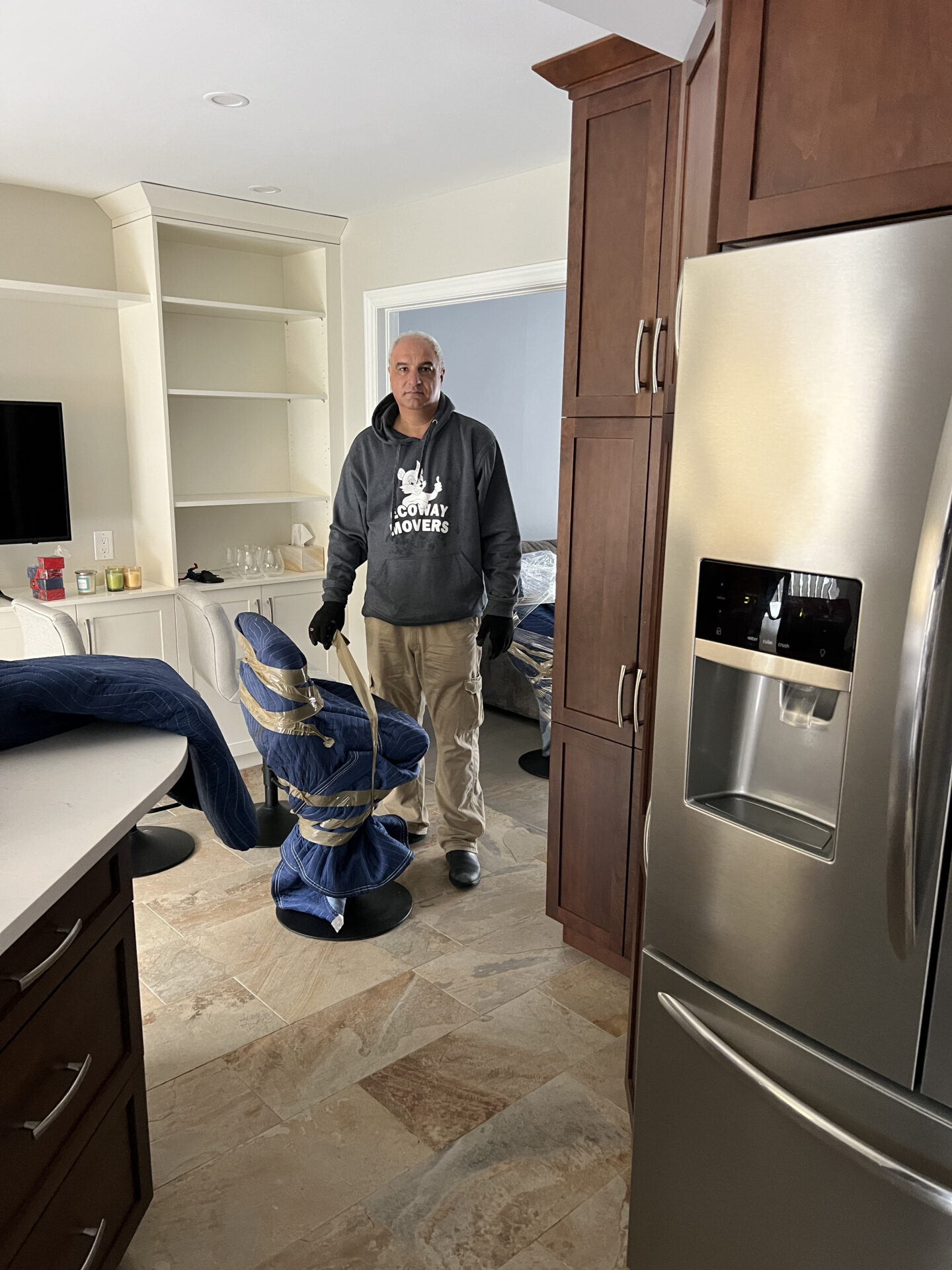 Ecoway Movers Vancouver BC professional crew packing kitchen items with specialty wrap and box protection during residential move in Vancouver