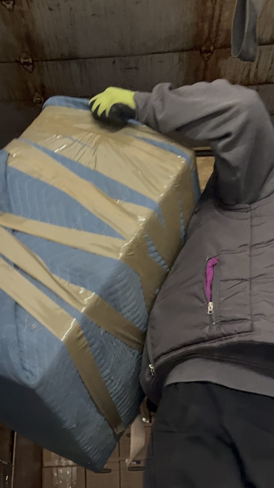 Ecoway Movers Regina SK certified crew using professional packing materials and secure wrapping techniques to protect household items during a residential move in Regina Saskatchewan