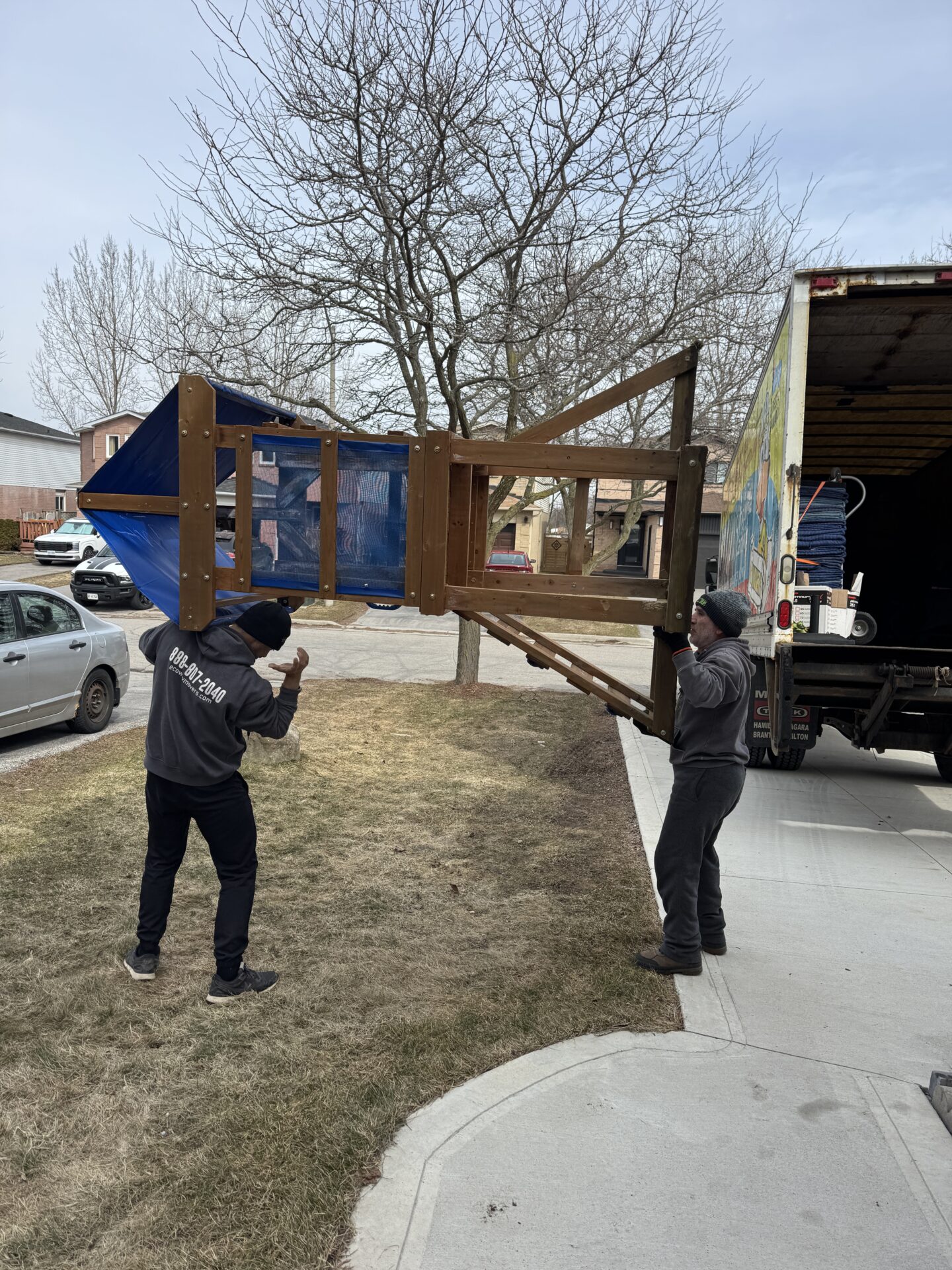 Floor protection setup and moving blankets in an inner-city Calgary condo move