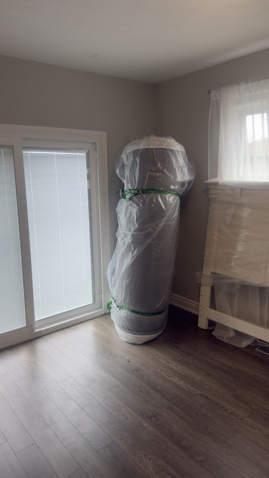 Ecoway Movers crew working inside a Kensington home with protected floors