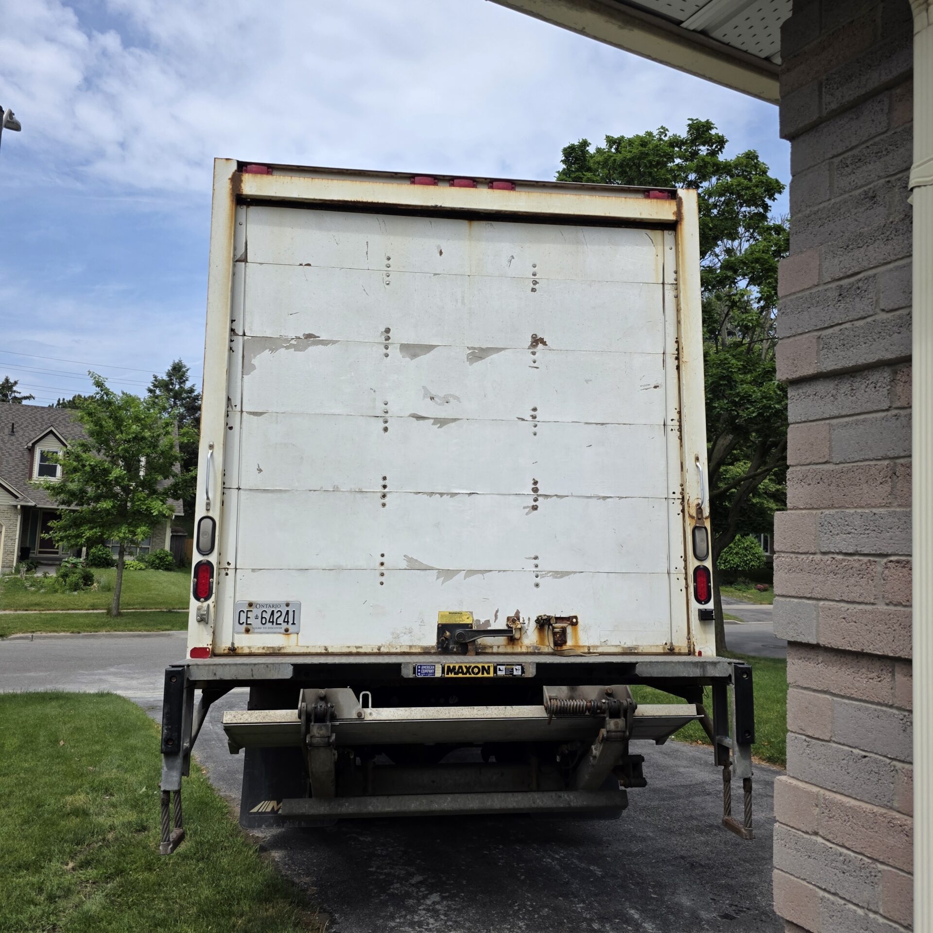 Ecoway Movers professional crew using specialized straps and padding to secure a piano for transport in Waterloo