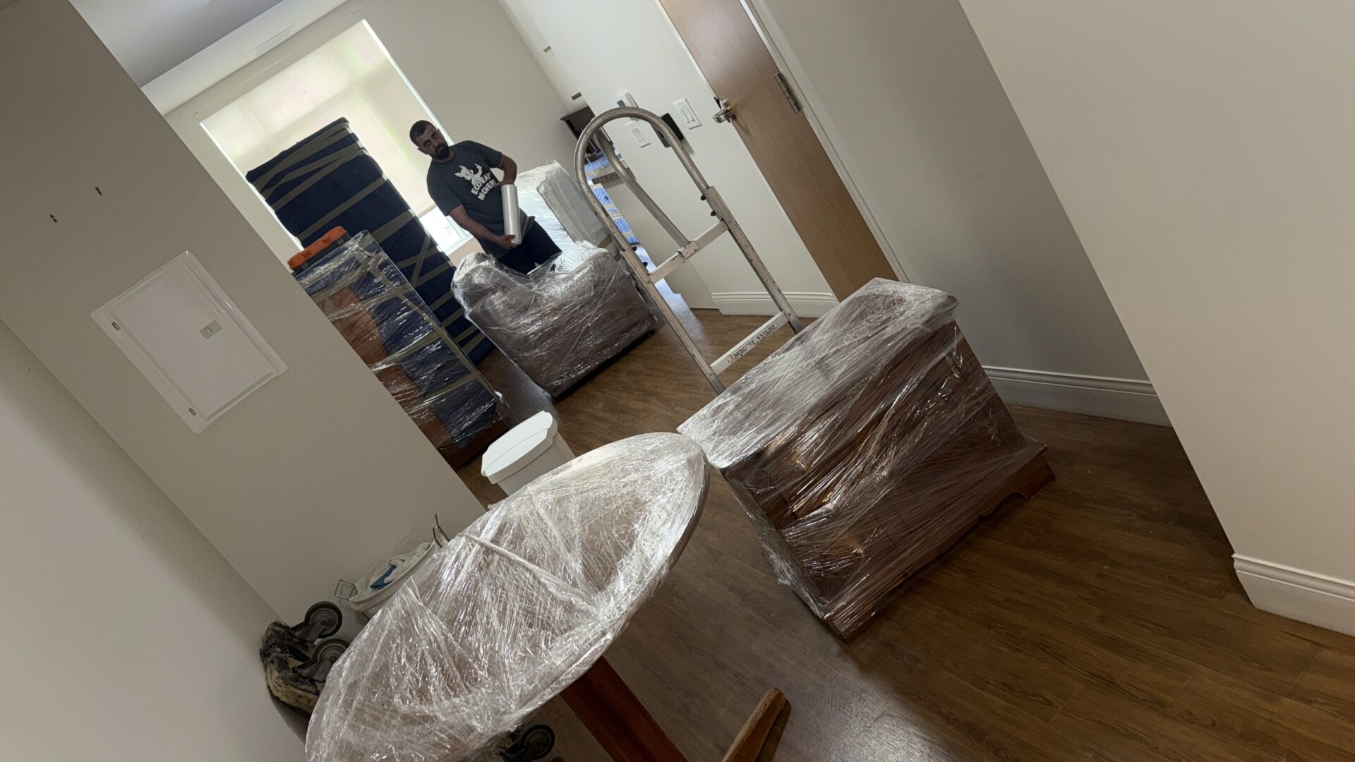 Ecoway Movers team member interacting patiently with a senior client during a move in Westmount Waterloo