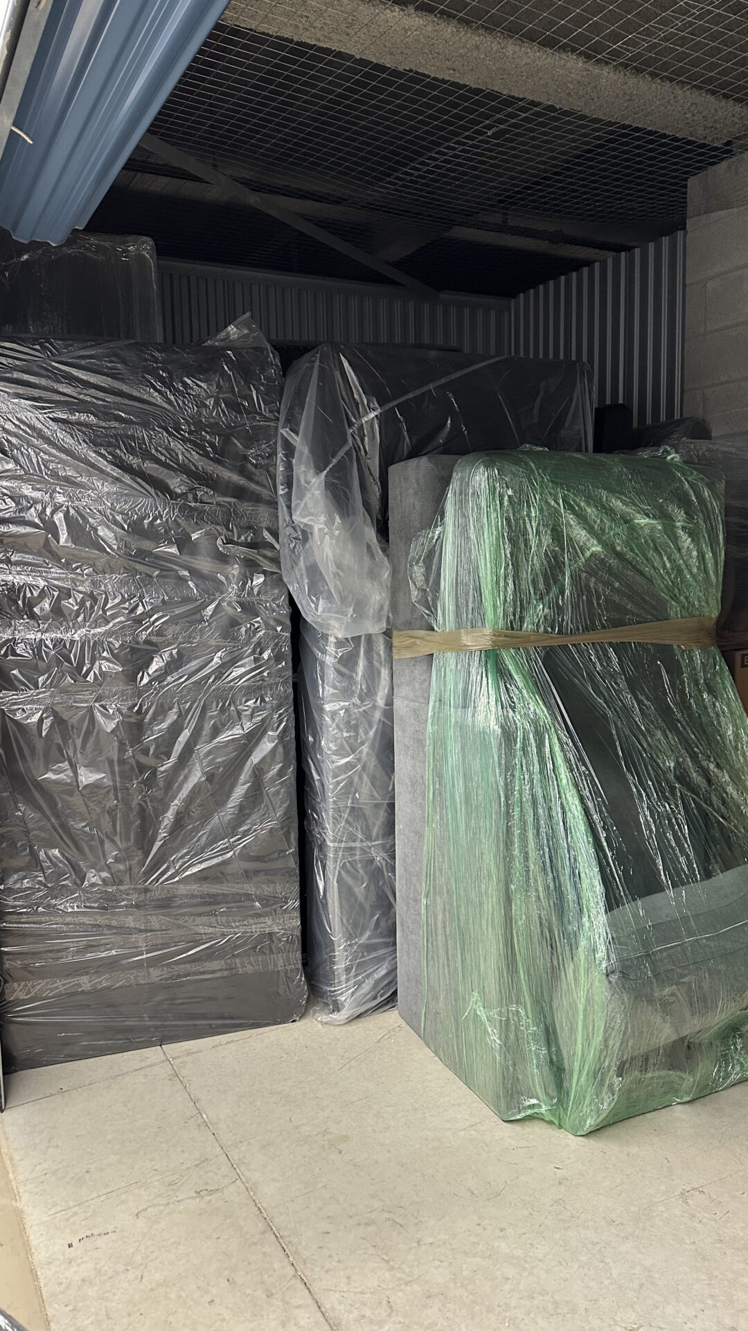 Ecoway Movers team loading a moving truck at an Albion Maple Ridge property with proper equipment and blanket-wrapped furniture