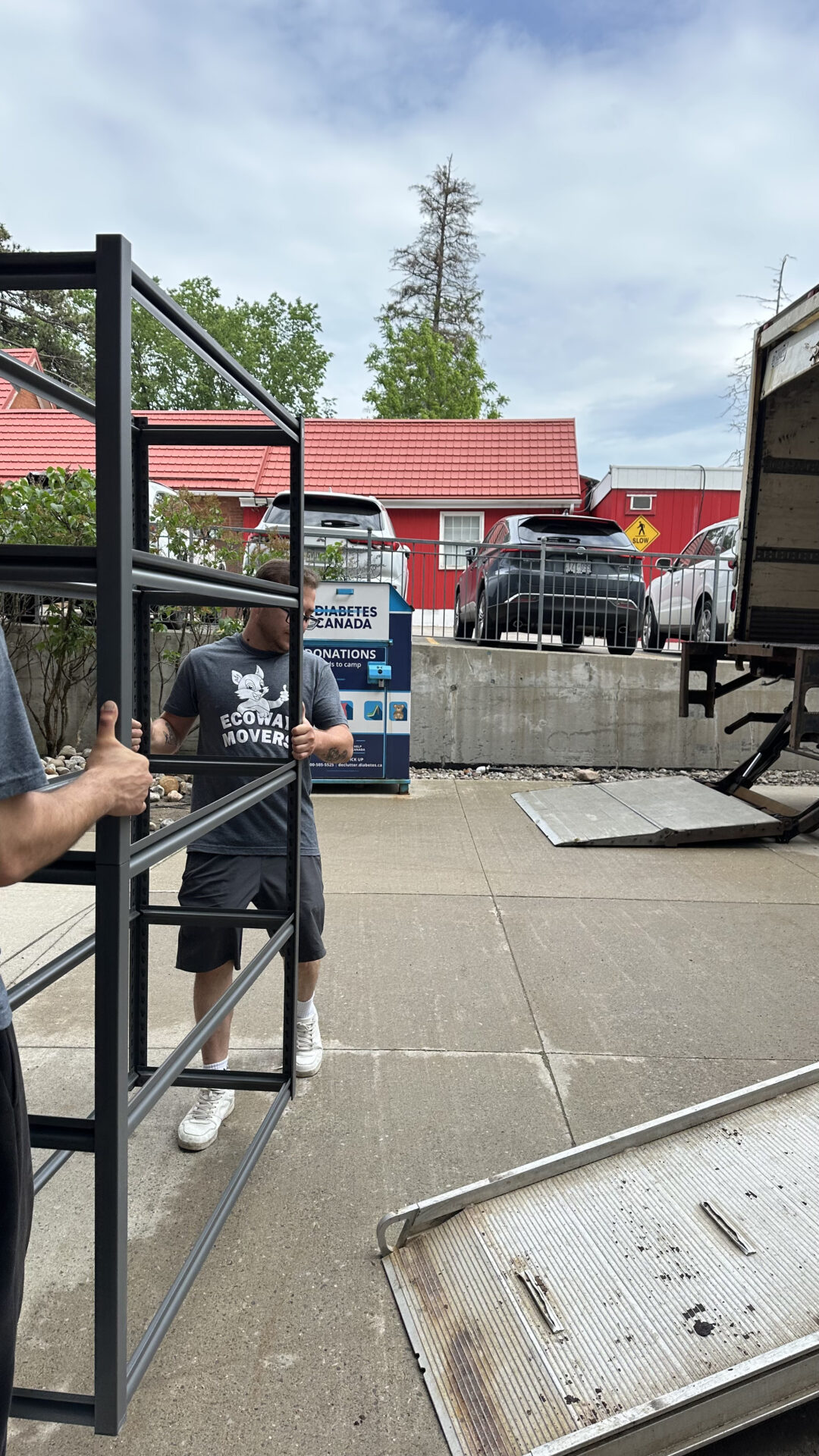 Ecoway Movers team member padding a vintage armoire during a local Wolseley residential move