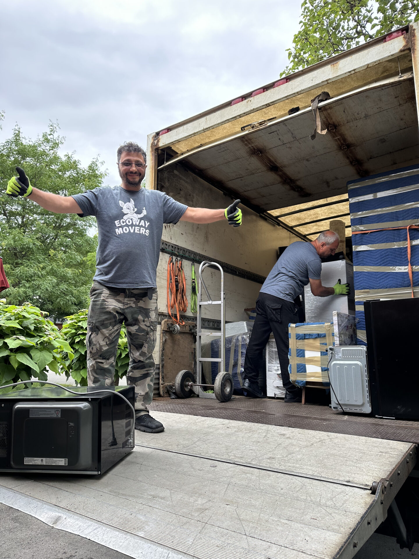 Ecoway Movers certified crew executing two-bedroom apartment relocation in Osborne Village with floor protection protocol