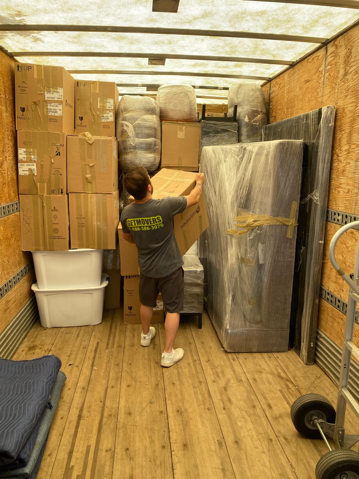 Get Movers Brampton ON professional vetted moving crews loading a winterized box truck securely in a Sandalwood sub-division