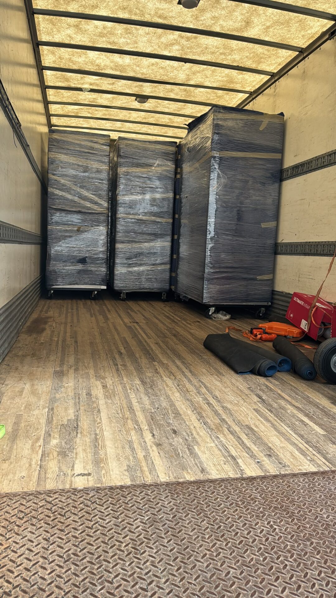 Get Movers Brampton ON team carefully transporting custom packed boxes down narrow townhouse stairs in Sandalwood using banister padding