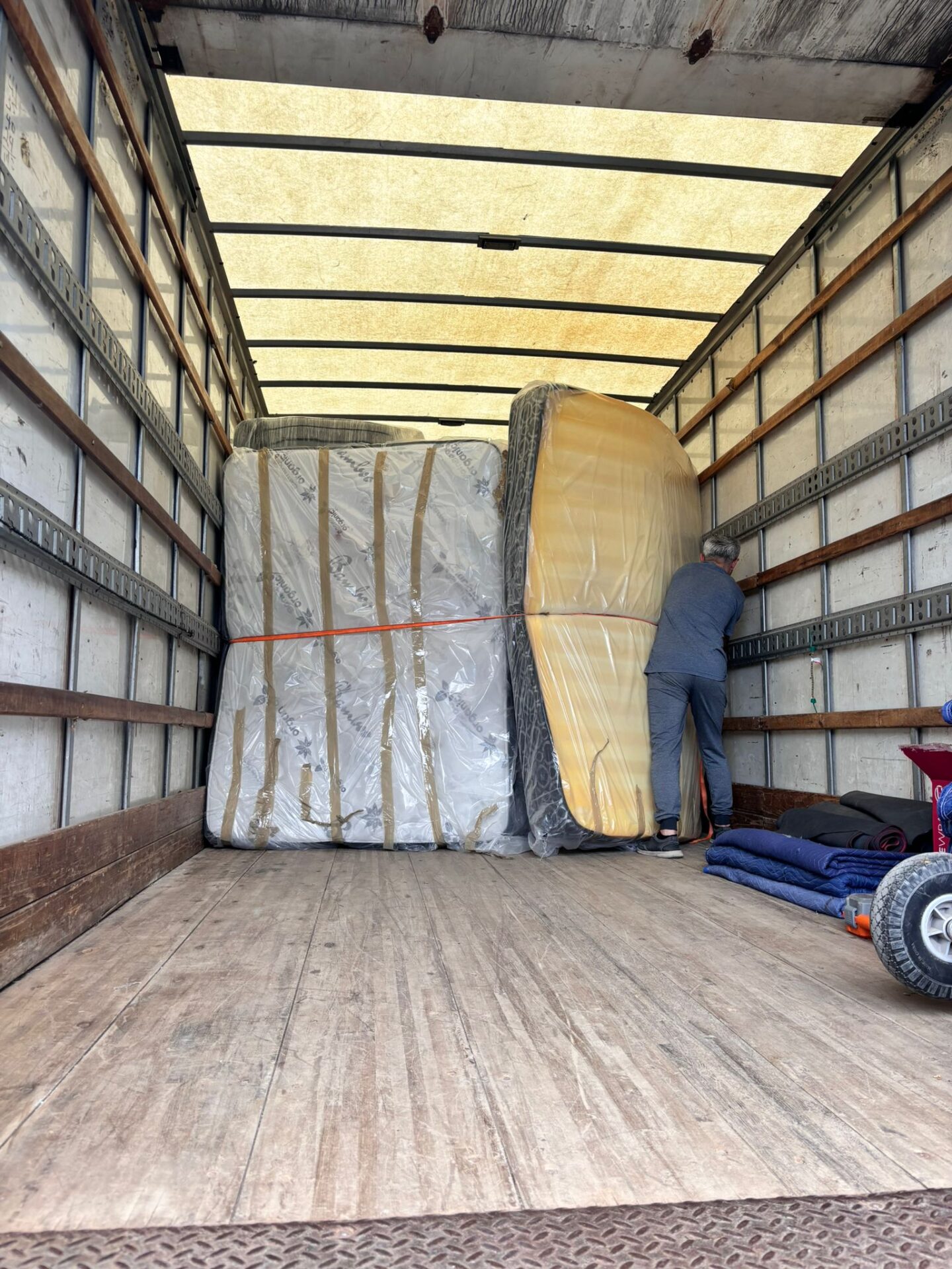 Ecoway Movers installing neoprene floor runners and custom crating for heavy furniture protection during Bronte Meadows move