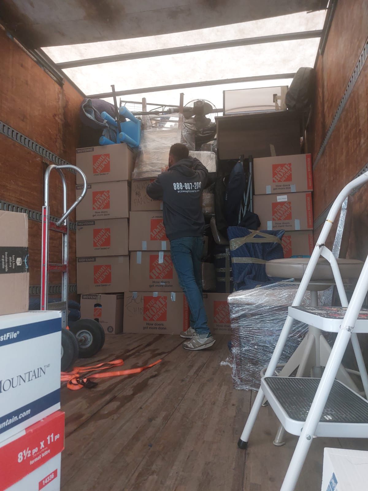 why-choose-ecoway-movers-boyne.jpg Ecoway Movers crew carefully wrapping furniture with protective blankets for a Boyne Milton townhome move