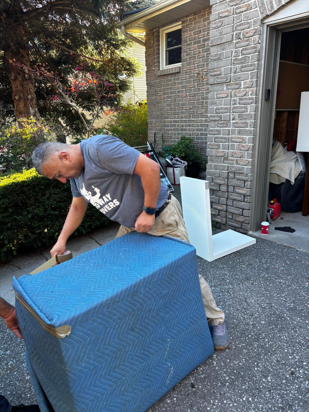 packing-disassembly-movers-milton.jpg Ecoway Movers securely packing fragile kitchenware and disassembling heavy furniture in a Boyne Milton home