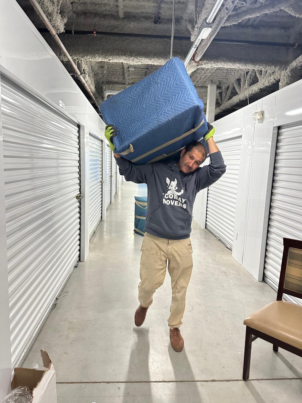 Ecoway Movers team loading furniture into a moving truck during a home relocation