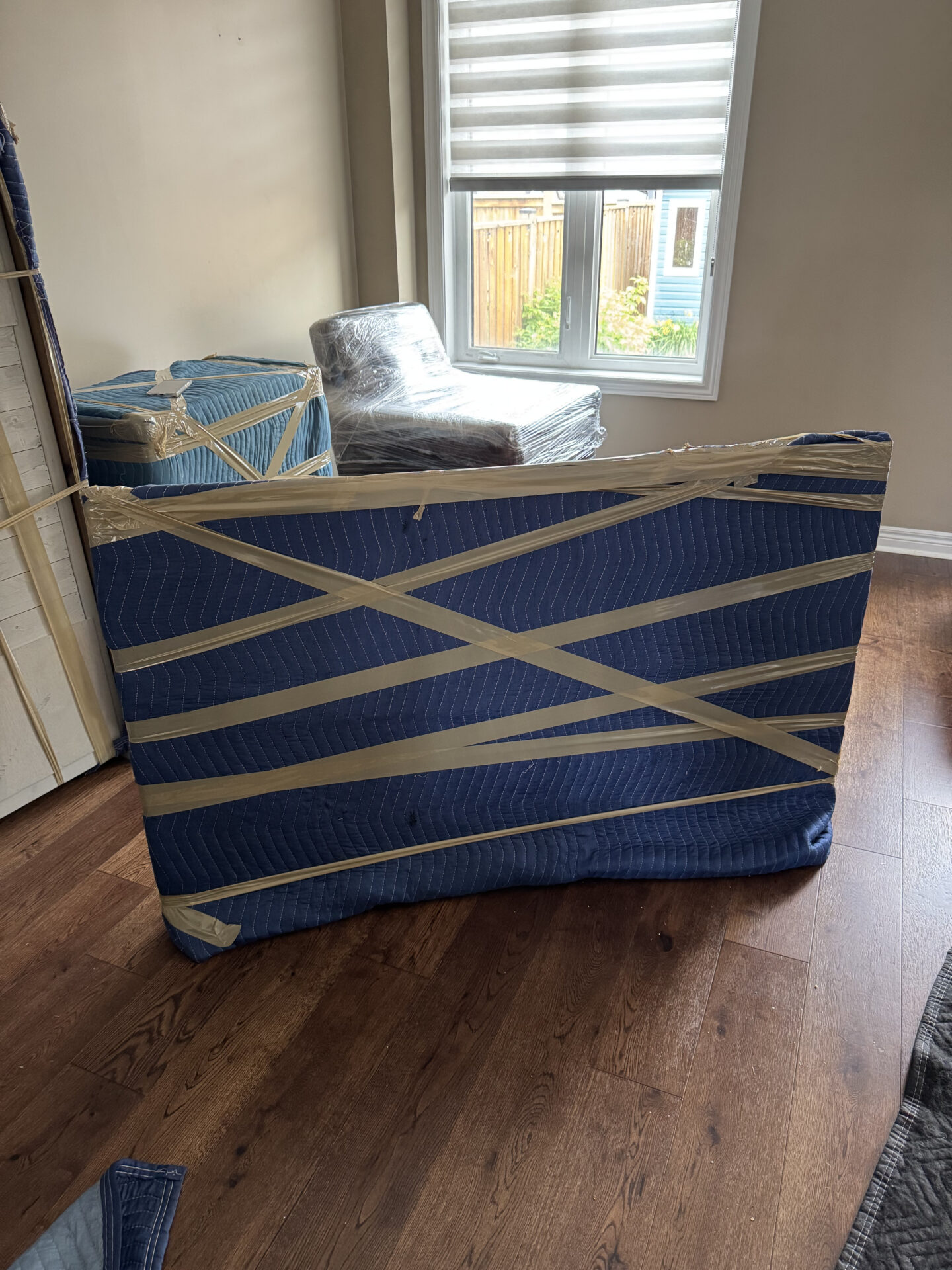 Ecoway Movers Cambridge crew executing professional piano relocation in historic Galt using custom dollies and protective padding protocol