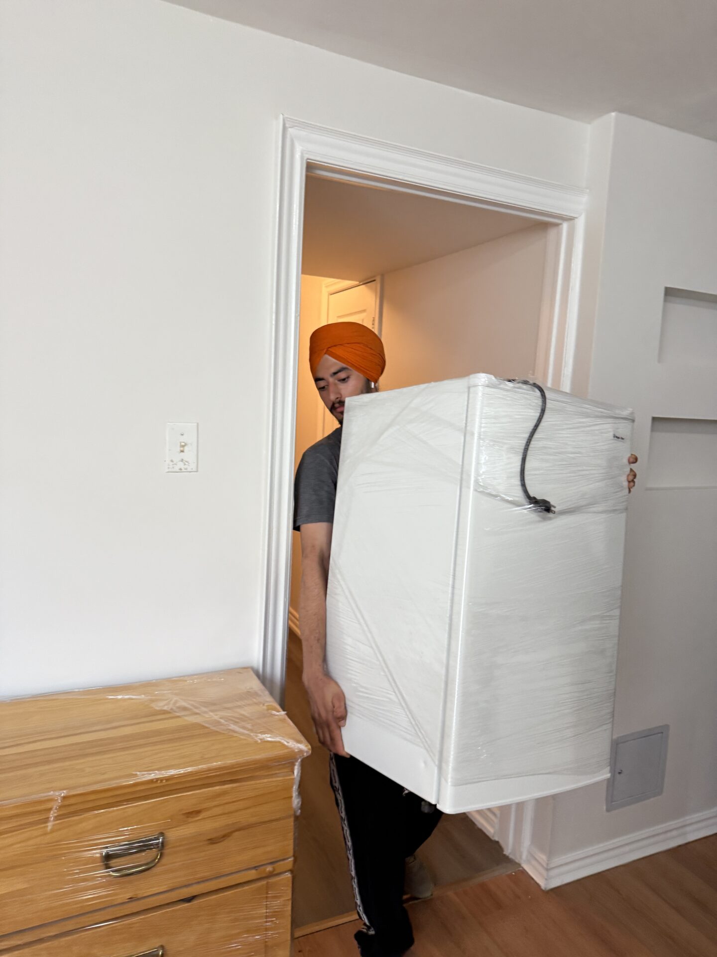 Ecoway Movers Cambridge professional crew completing residential relocation in Preston neighbourhood with full furniture wrap and floor protection protocol