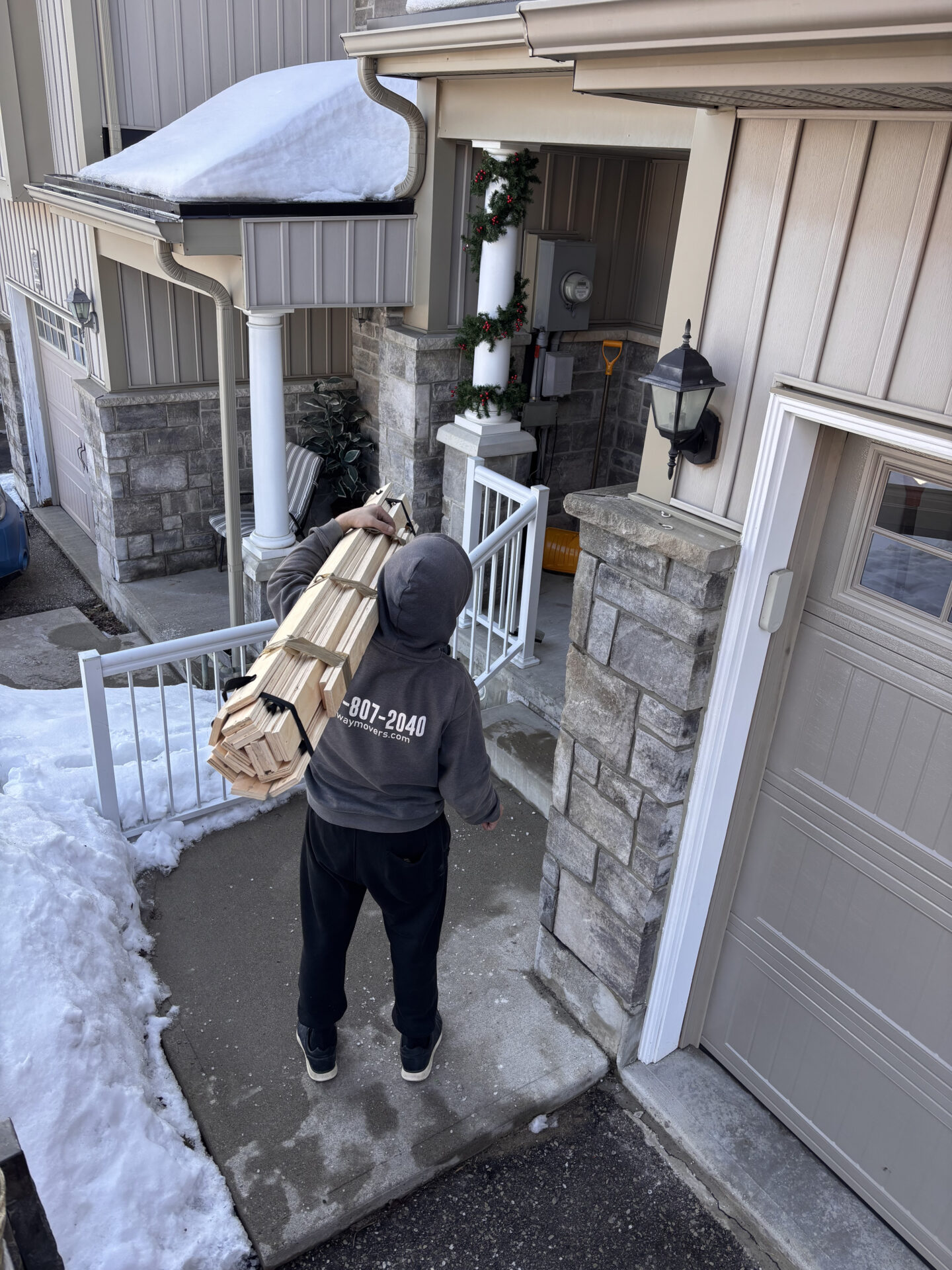 Professional movers in Edmonton loading furniture during a residential relocation