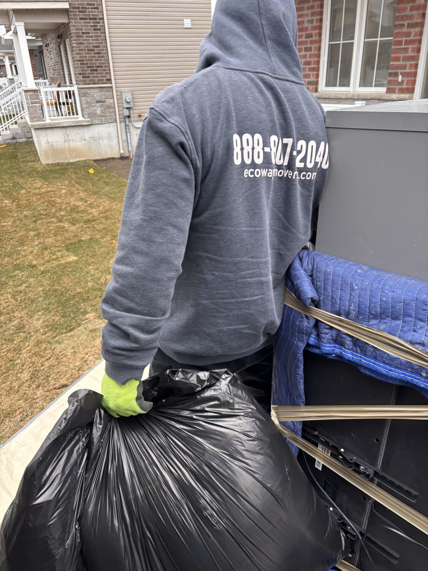 Ecoway Movers Belleville crew applying floor protection protocol during residential move in East Hill neighbourhood